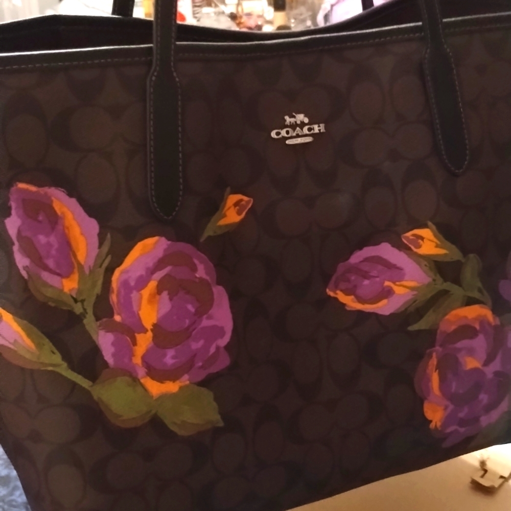 Brown and black Coach with Purple flowers